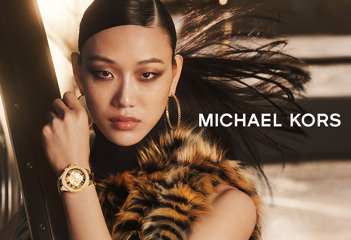 Michael Kors gold watch and Accessory Concierge bracelet, and